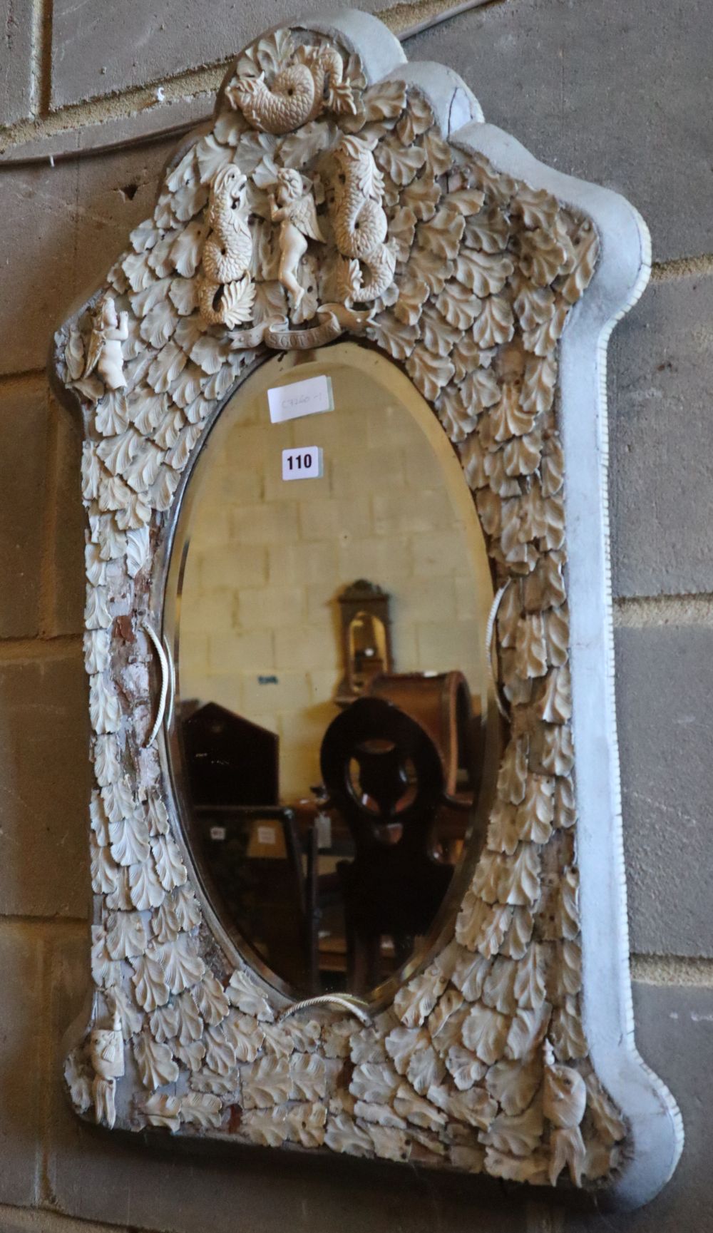 A late 19th century Dieppe ivory and bone mirror, width 52cm, height 82cm